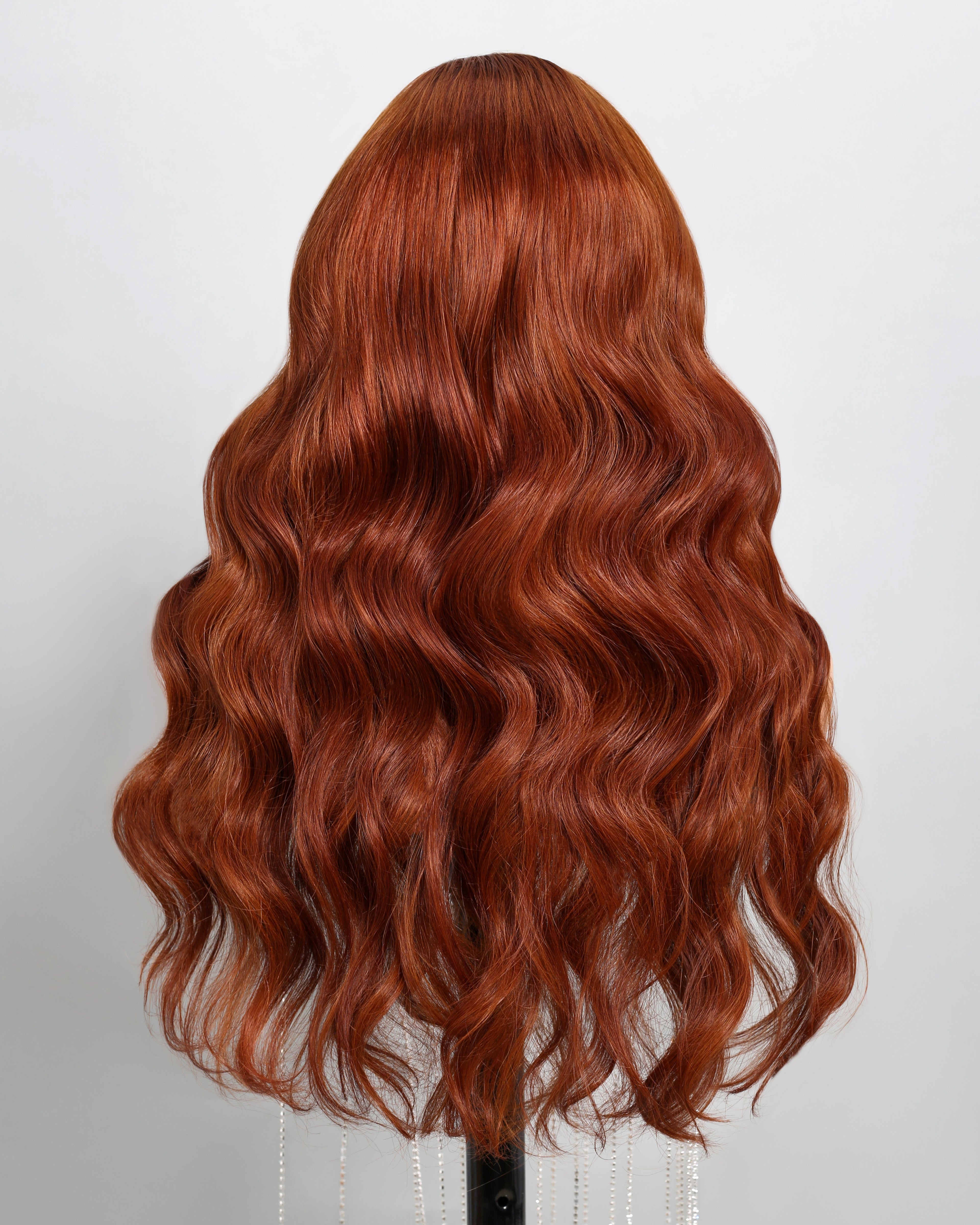Arabella ginger human hair wig on mannequin—back view, loose body wave texture